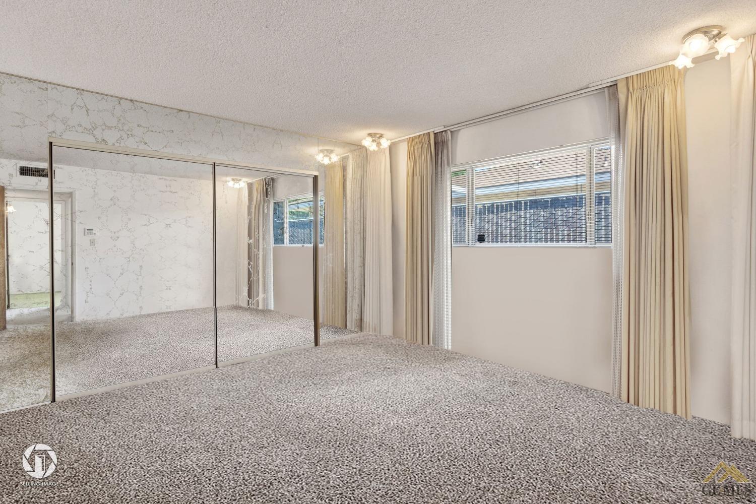 Undisclosed Address Bakersfield, CA 93308 - Photo 21 of 45 a view of an empty room and a window