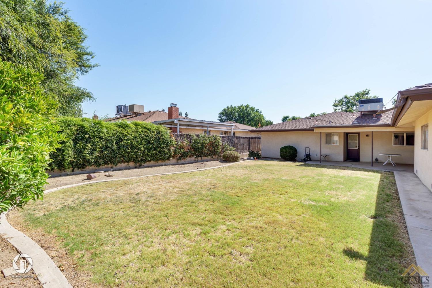 Undisclosed Address Bakersfield, CA 93308 - Photo 32 of 45 a front view of a house with a yard