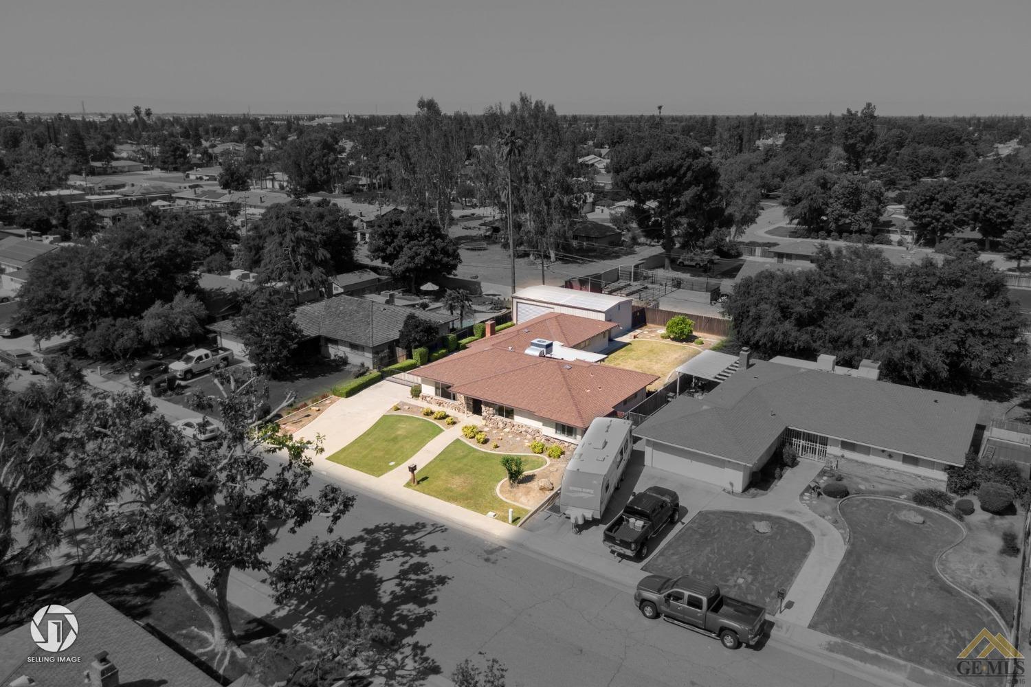 Undisclosed Address Bakersfield, CA 93308 - Photo 37 of 45 an aerial view of a house with a swimming pool