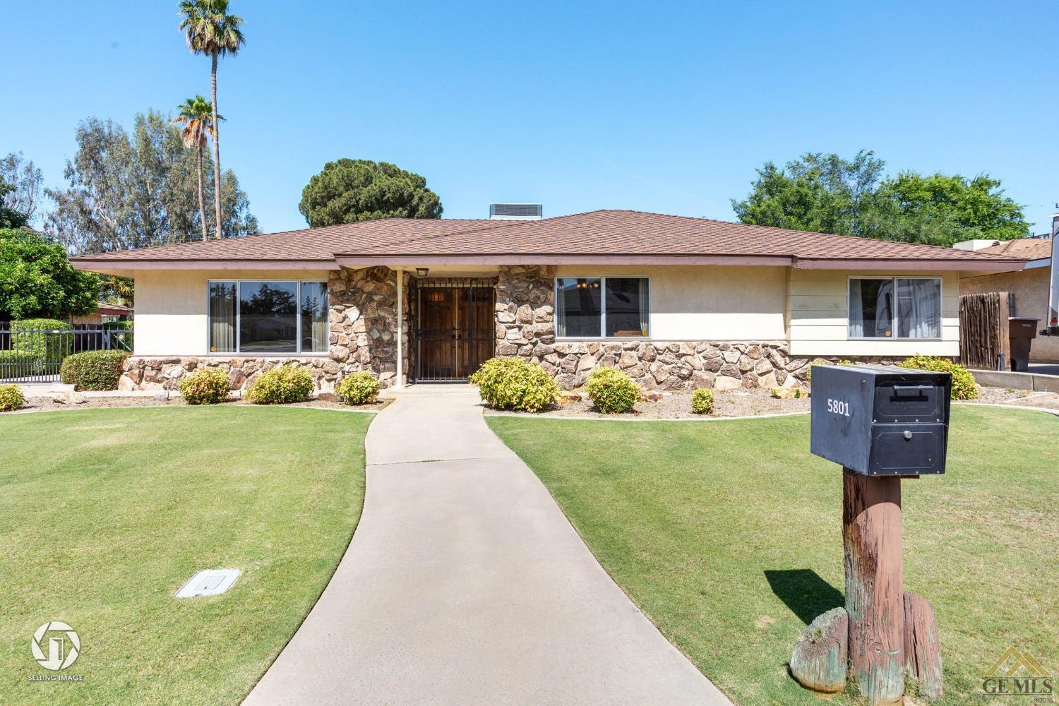 Undisclosed Address Bakersfield, CA 93308 - Photo 7 of 45 a front view of house with yard outdoor seating and barbeque oven