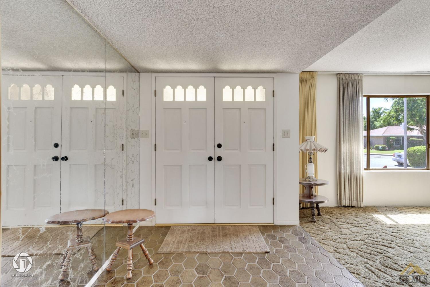 Undisclosed Address Bakersfield, CA 93308 - Photo 8 of 45 a view of an empty room with wooden floor and a window