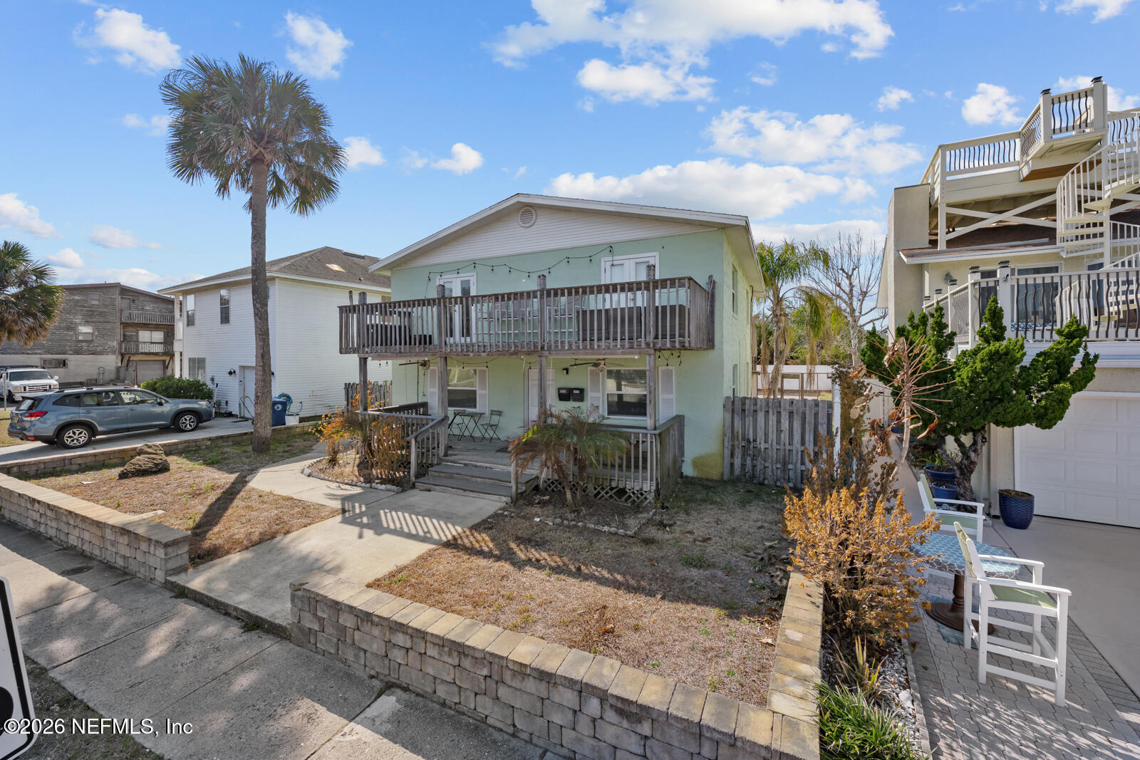 1914 First Street Neptune Beach, FL 32266 - Photo 16 of 55 a front view of a house with garden and sitting area