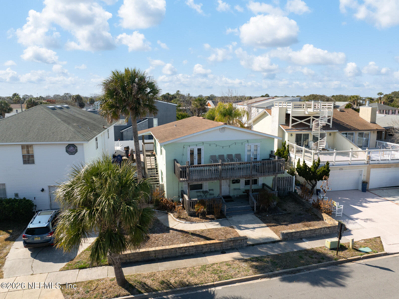 1914 First Street Neptune Beach, FL 32266 - Photo 19 of 55 a front view of a house with garden
