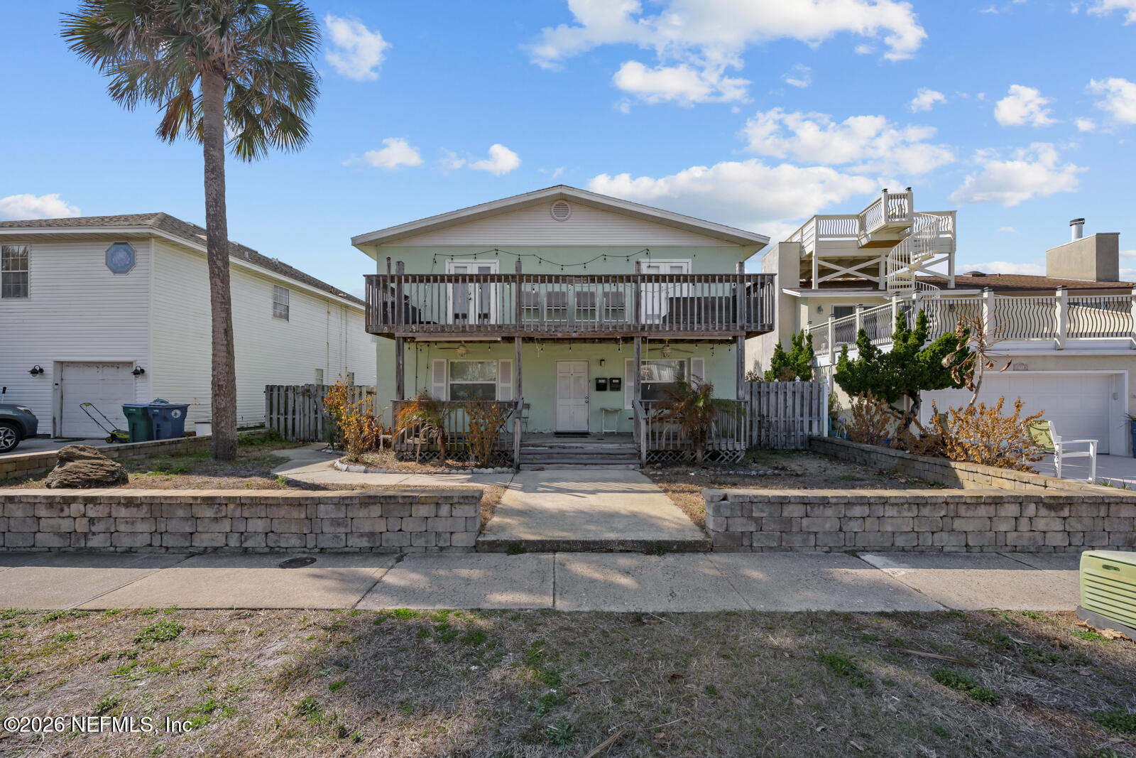 1914 First Street Neptune Beach, FL 32266 - Photo 5 of 55 a front view of a house with garden