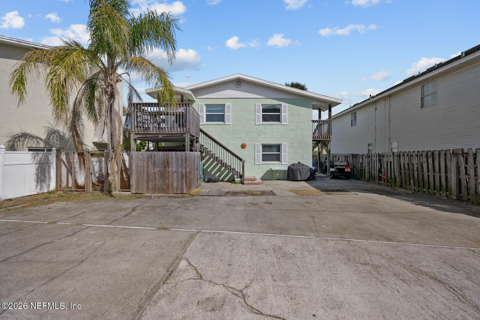 1914 First Street Neptune Beach, FL 32266 - Photo 10 of 55 a view of a house with a yard and garage