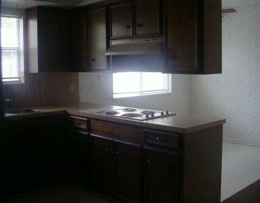 5829 Trieste Drive Corpus Christi, TX 78413 - Photo 3 of 3 a kitchen with a sink and cabinets