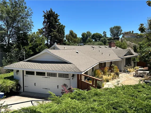 a aerial view of a house with a yard