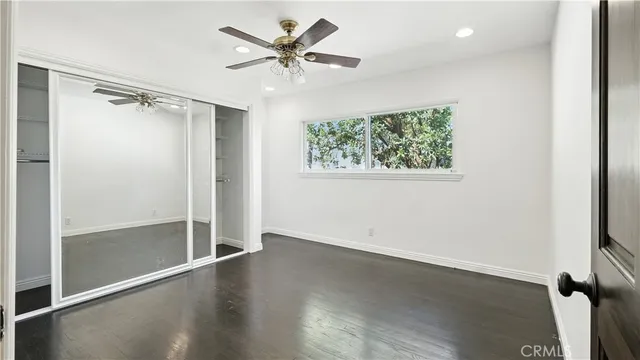 a bathroom with a sink vanity toilet and shower