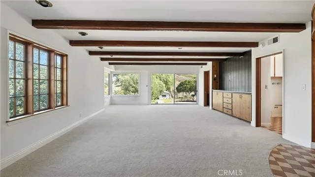 a view of livingroom with furniture and windows