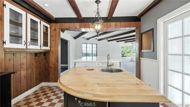 a view of a kitchen with a sink and cabinets