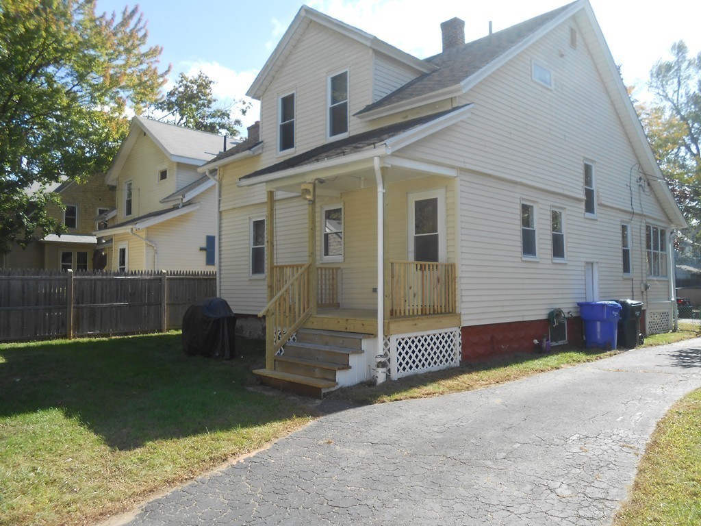 32 Larkspur Street Springfield, MA 01108 - Photo 13 of 26 a view of a house with a yard and garage