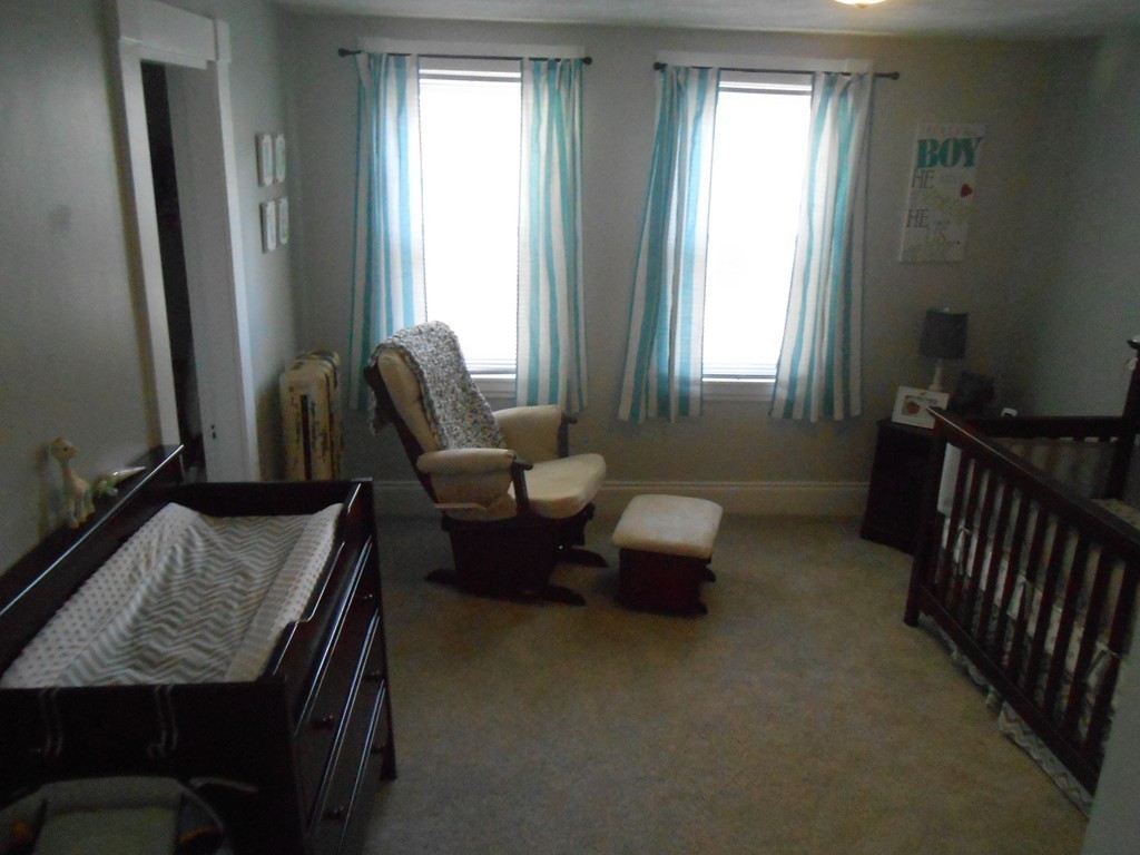 32 Larkspur Street Springfield, MA 01108 - Photo 15 of 26 a living room with furniture and a window
