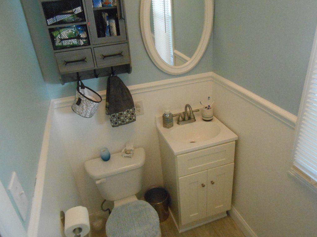 32 Larkspur Street Springfield, MA 01108 - Photo 17 of 26 a bathroom with a toilet sink and mirror