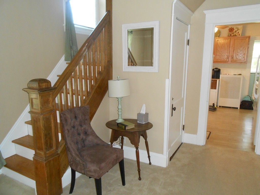 32 Larkspur Street Springfield, MA 01108 - Photo 19 of 26 a view of a hallway with furniture and a chandelier