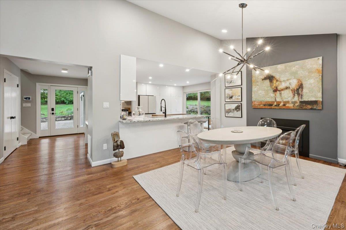 46 Ridgefield Avenue South Salem, NY 10590 - Photo 12 of 38 a open kitchen with stainless steel appliances kitchen island granite countertop a table chairs and a refrigerator