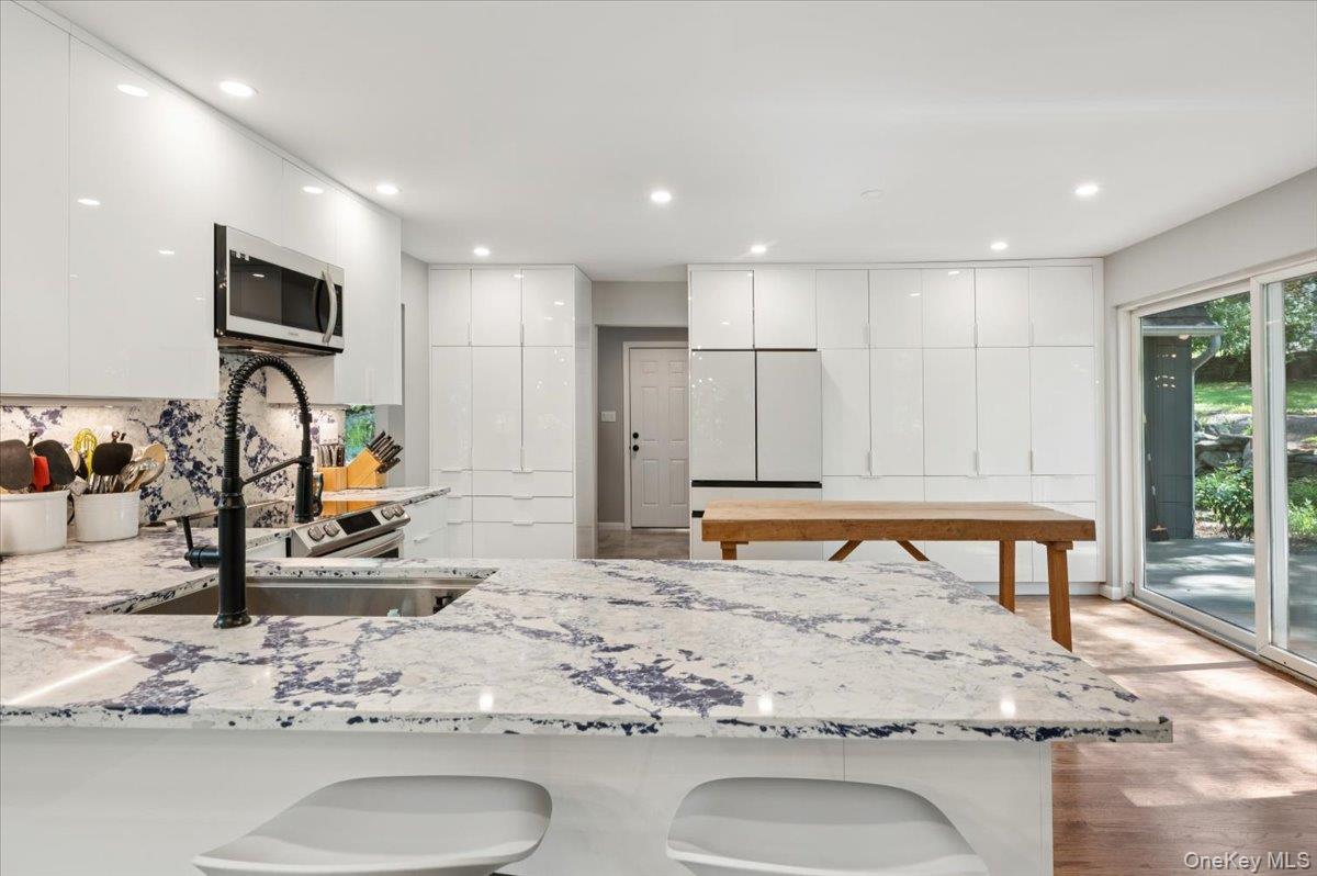 46 Ridgefield Avenue South Salem, NY 10590 - Photo 15 of 38 a view of kitchen island with stainless steel appliances granite countertop sink stove and refrigerator