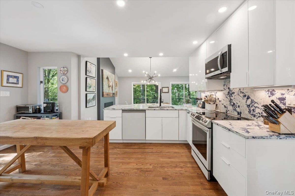 46 Ridgefield Avenue South Salem, NY 10590 - Photo 17 of 38 a kitchen with stainless steel appliances granite countertop a stove top oven a sink dishwasher and a refrigerator