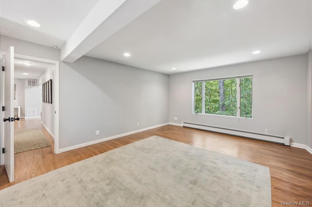 46 Ridgefield Avenue South Salem, NY 10590 - Photo 22 of 38 an empty room with wooden floor and windows