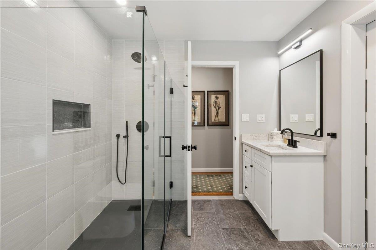 46 Ridgefield Avenue South Salem, NY 10590 - Photo 23 of 38 a bathroom with a shower sink and mirror