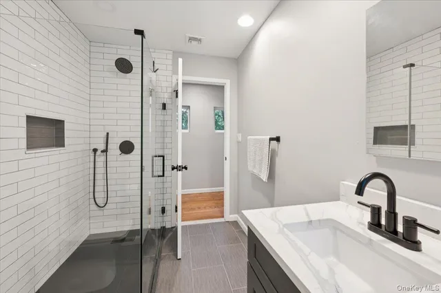 a bathroom with a sink and a shower