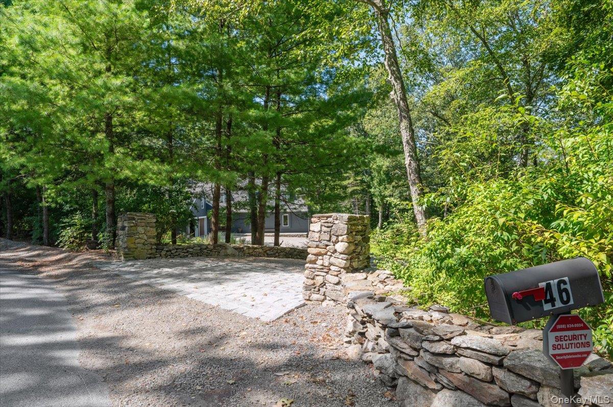 46 Ridgefield Avenue South Salem, NY 10590 - Photo 4 of 38 a wooden fence with trees in the background