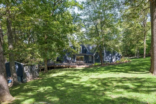a view of a house with a yard porch and sitting area