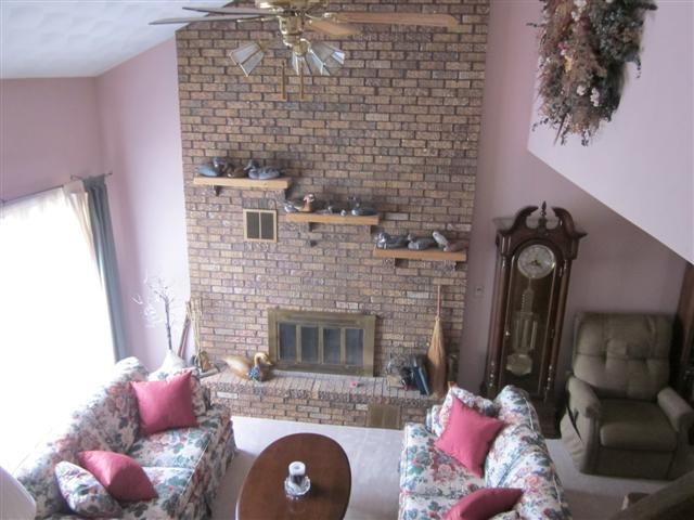 901 Winborne Road Lake Summerset, IL 61019 - Photo 5 of 16 a living room with furniture and a fireplace