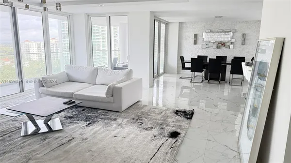 a living room with furniture and a large window