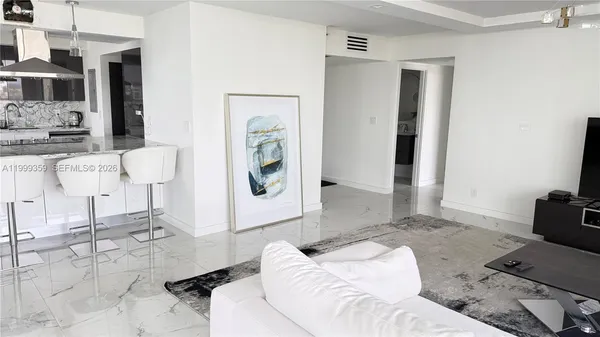 a living room with furniture and a rug