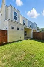 a view of a backyard of the house