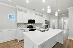 a kitchen with a sink a stove and refrigerator