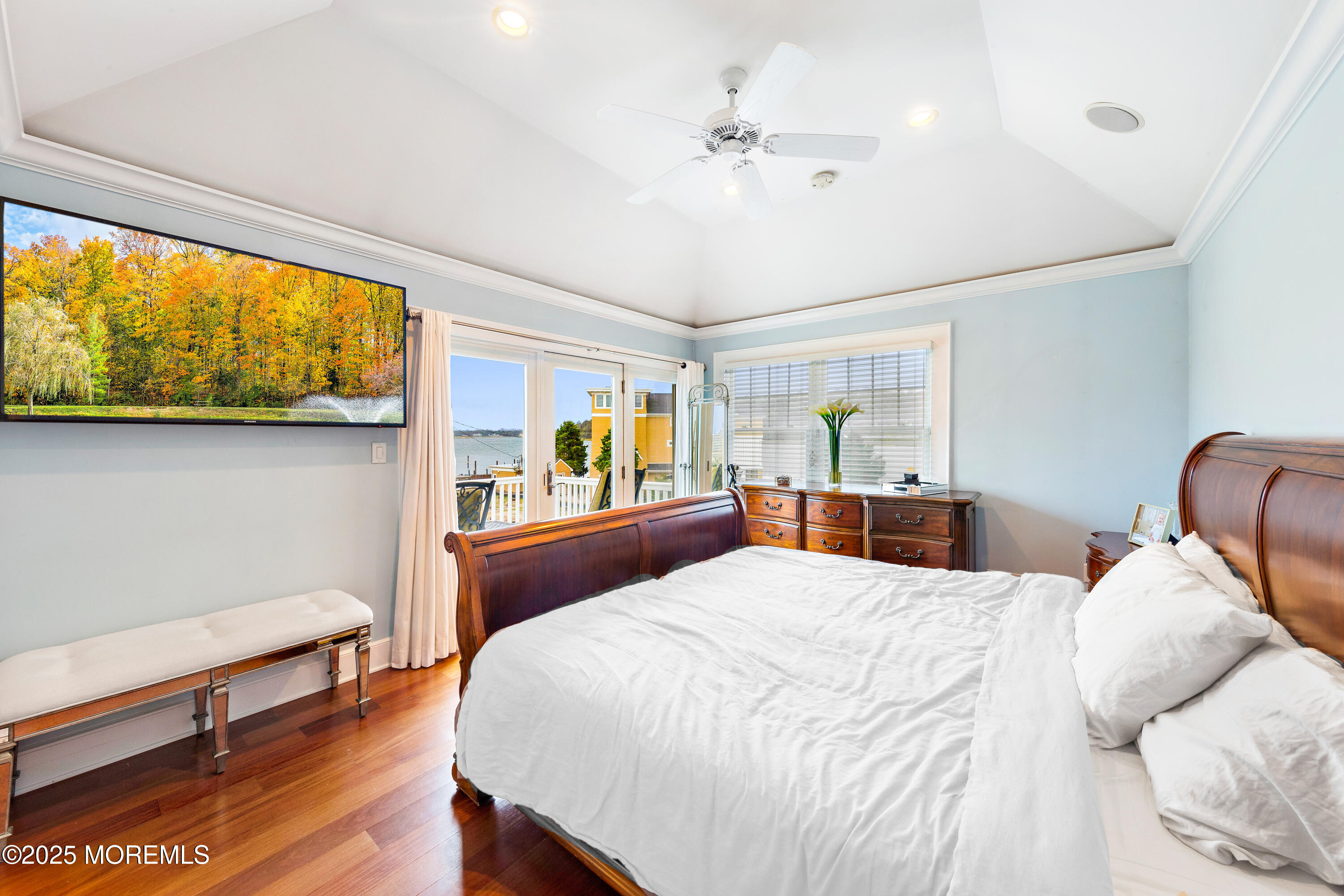 6 Via Ripa Sea Bright, NJ 07760 - Photo 15 of 25 a bedroom with a large bed and a chandelier