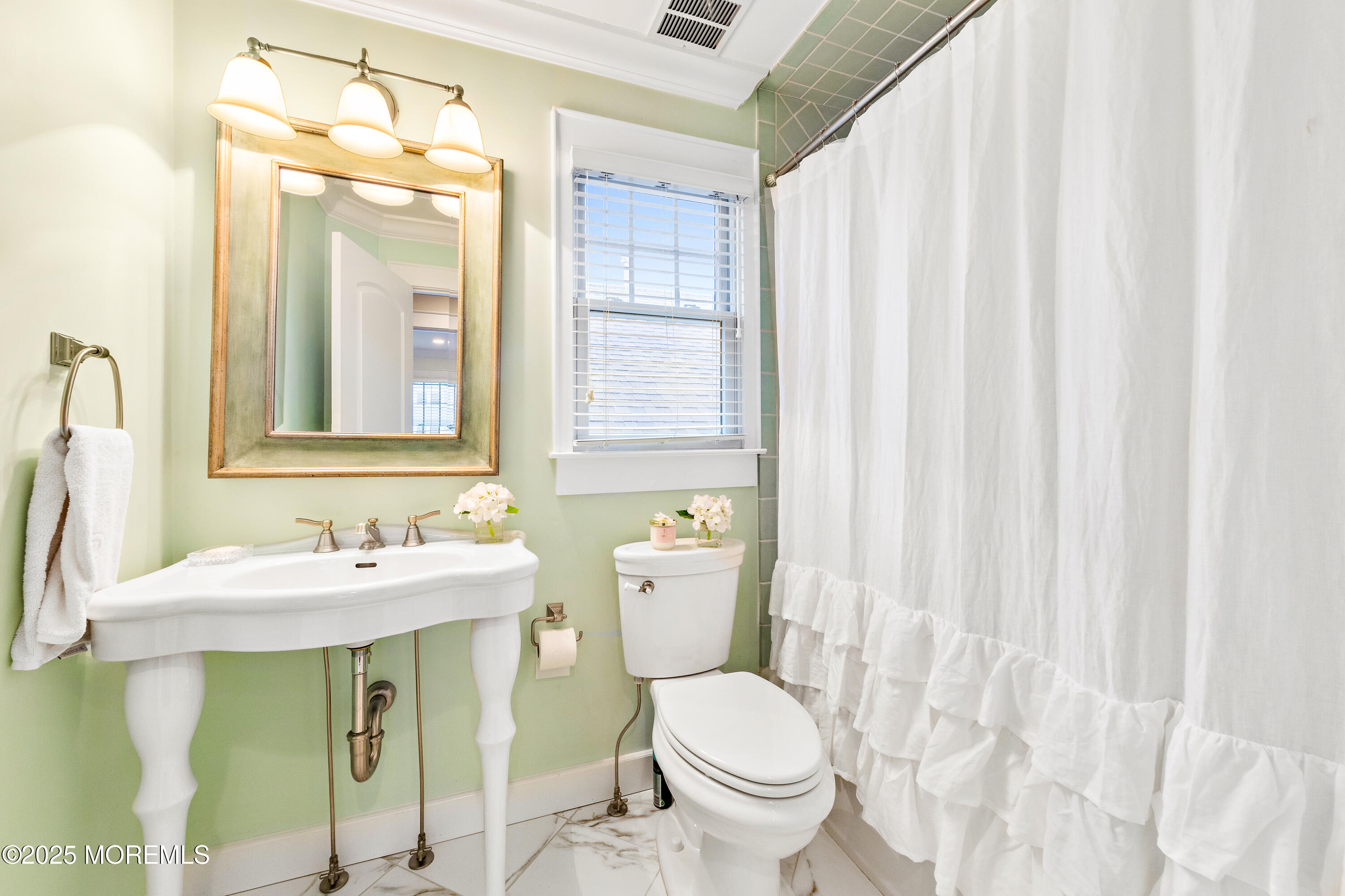 6 Via Ripa Sea Bright, NJ 07760 - Photo 22 of 25 a bathroom with a toilet sink and mirror