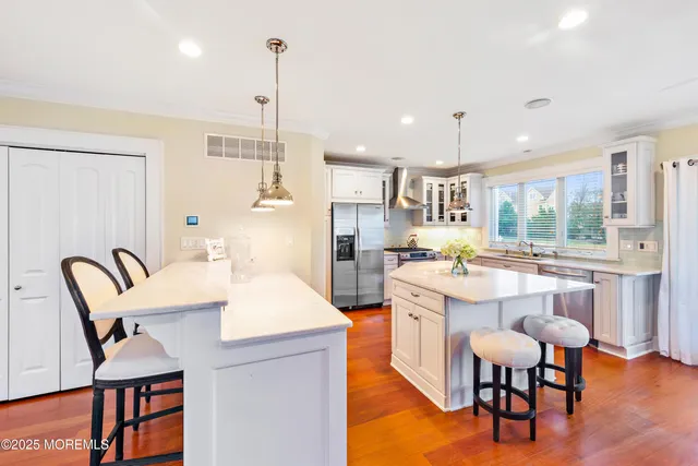 a large kitchen with a table and chairs