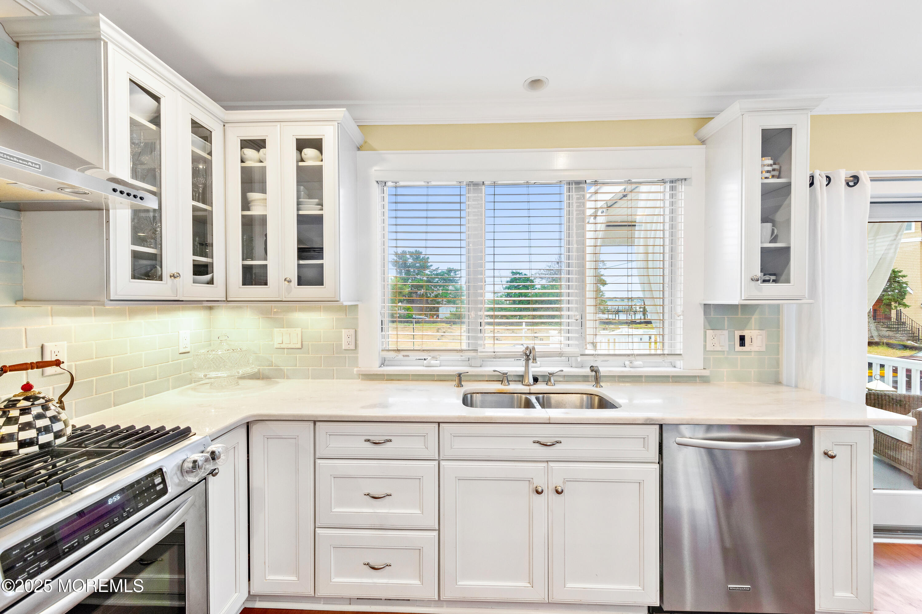 6 Via Ripa Sea Bright, NJ 07760 - Photo 7 of 25 a kitchen with granite countertop a sink stove and cabinets