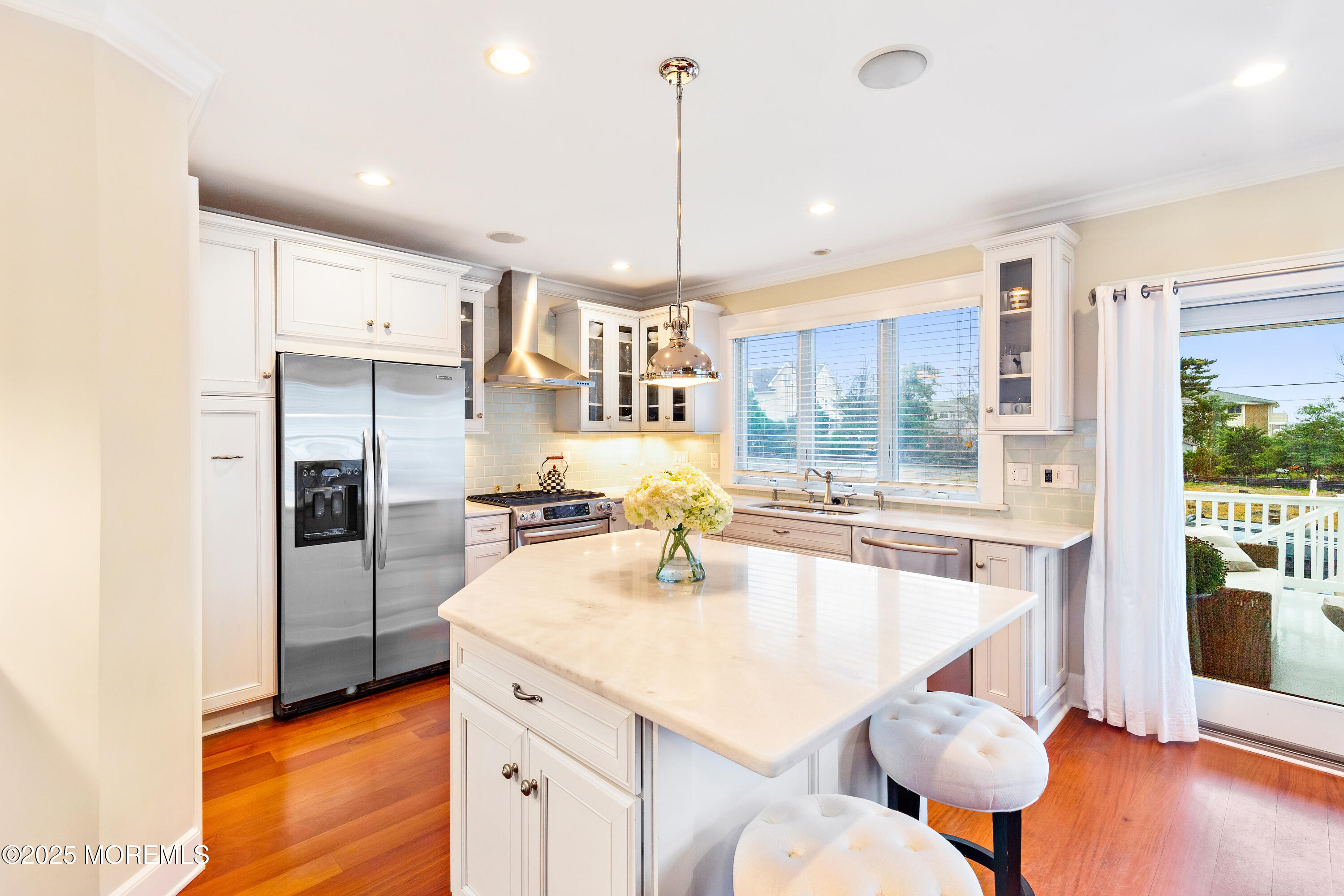 6 Via Ripa Sea Bright, NJ 07760 - Photo 8 of 25 a kitchen with refrigerator and chairs