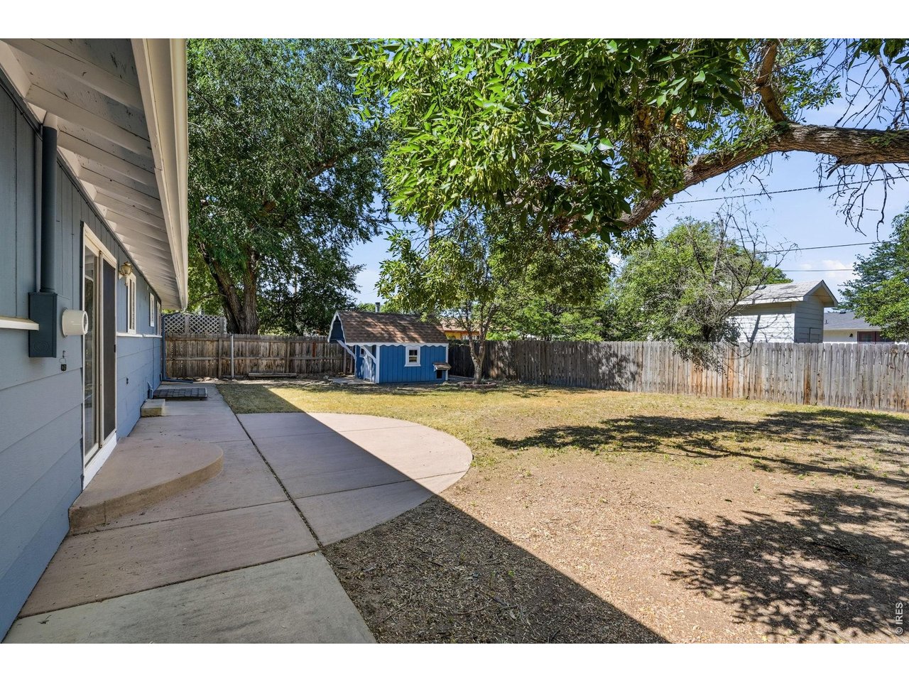 1035 6th Street Berthoud, CO 80513 - Photo 29 of 37 a view of a swimming pool with a yard