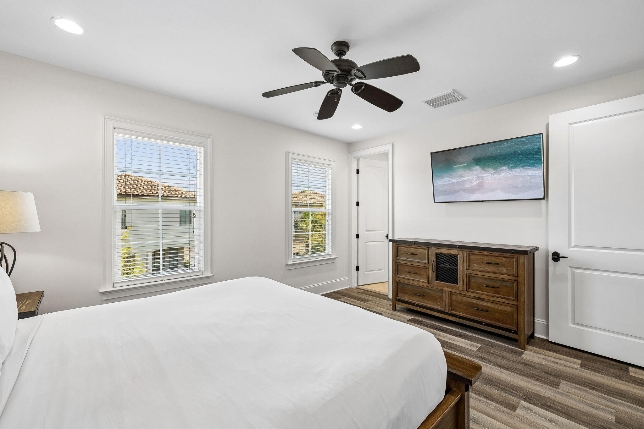 1973 Baytowne Loop Miramar Beach, FL 32550 - Photo 23 of 38 a bedroom with a bed and a flat screen tv