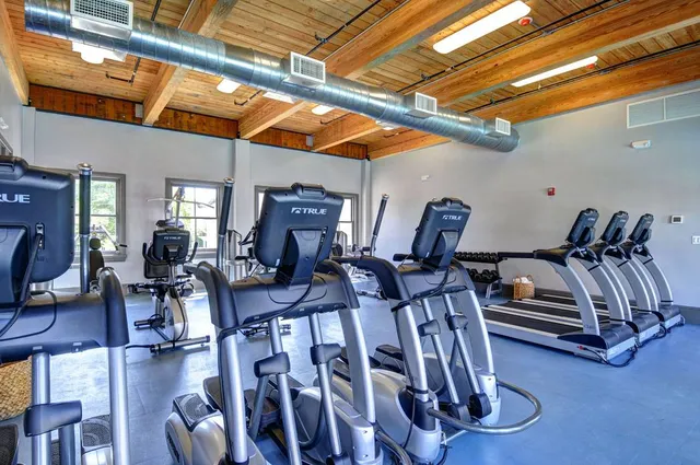 a view of a patio with table and chairs and plants