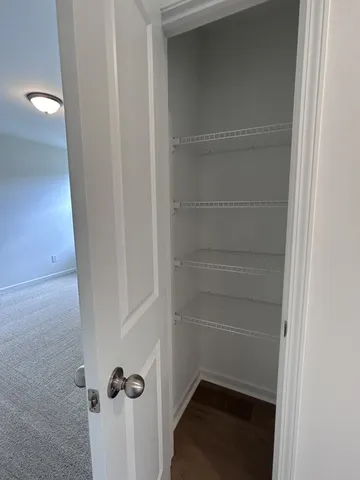 a view of a bathroom from a hallway