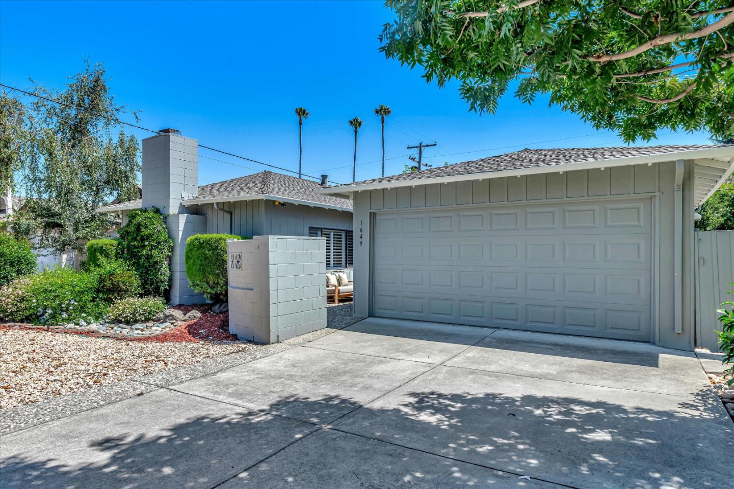 1649 Lee Drive Mountain View, CA 94040 - Photo 2 of 35 a front view of a house with a yard and garage