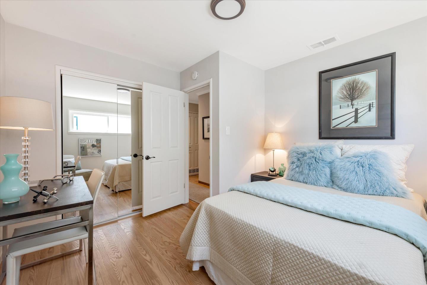 1649 Lee Drive Mountain View, CA 94040 - Photo 23 of 35 a bedroom with a bed and wooden floor