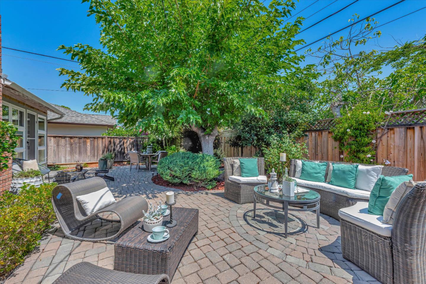 1649 Lee Drive Mountain View, CA 94040 - Photo 34 of 35 a view of a patio with couches table and chairs and potted plants