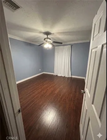 wooden floor in an empty room with a mirror