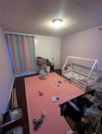 a bed room with a bed and a computer