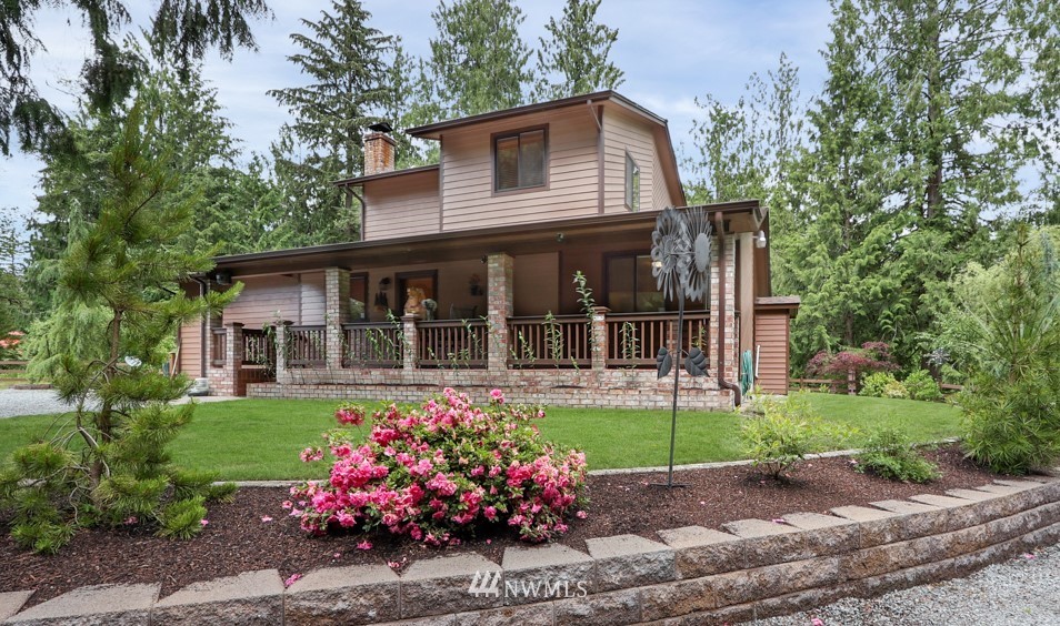 25308 Brooks Road East Orting, WA 98360 - Photo 1 of 40 front view of a house with a yard