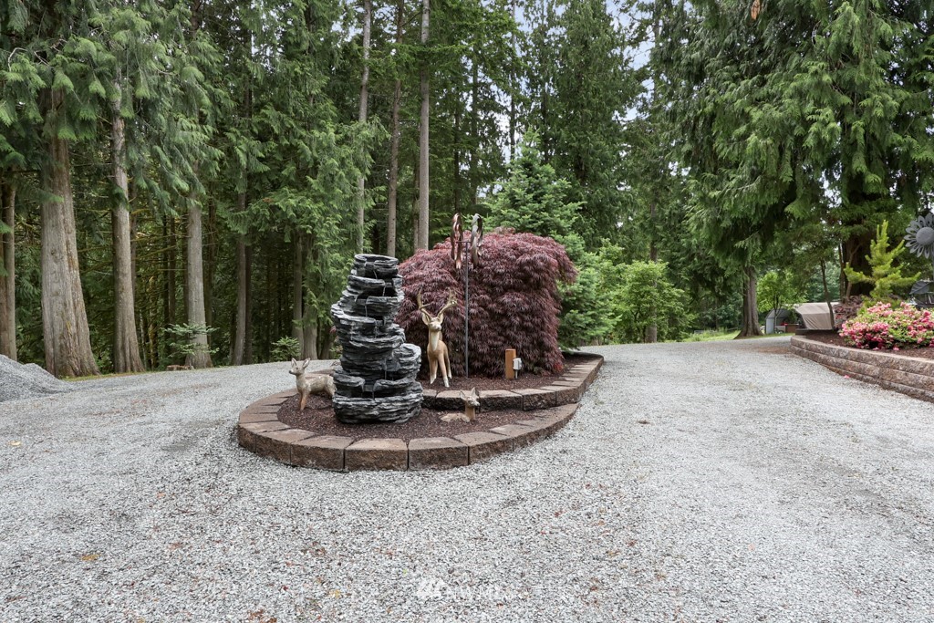 25308 Brooks Road East Orting, WA 98360 - Photo 2 of 40 a view of a tiny house with yard and trees