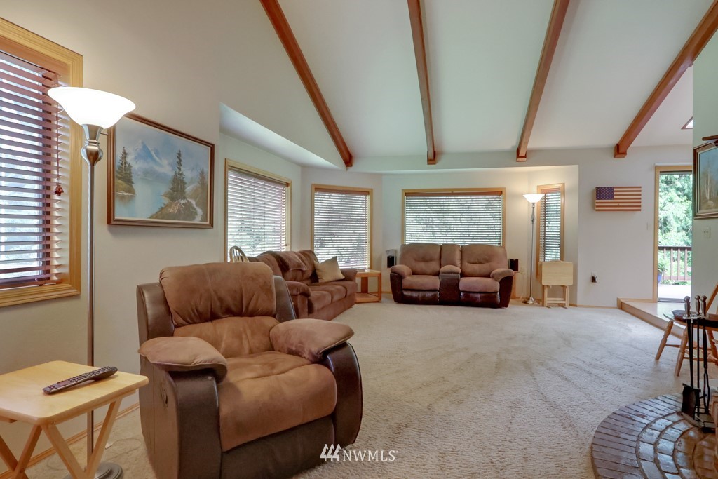 25308 Brooks Road East Orting, WA 98360 - Photo 17 of 40 a living room with furniture and a large window