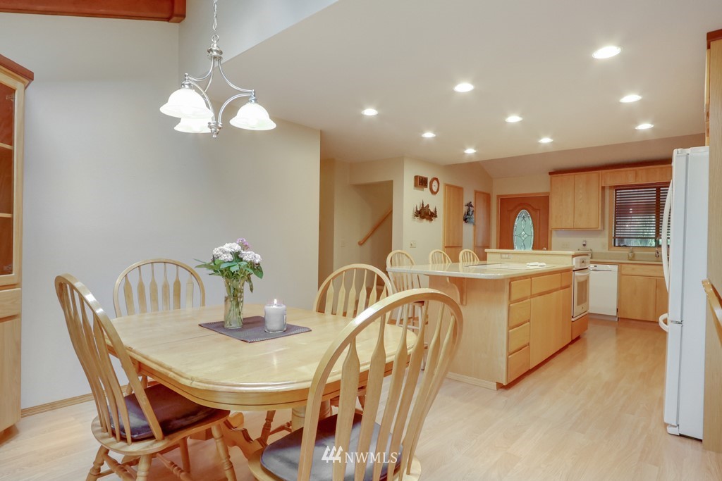 25308 Brooks Road East Orting, WA 98360 - Photo 18 of 40 a kitchen with counter space dining table and chair