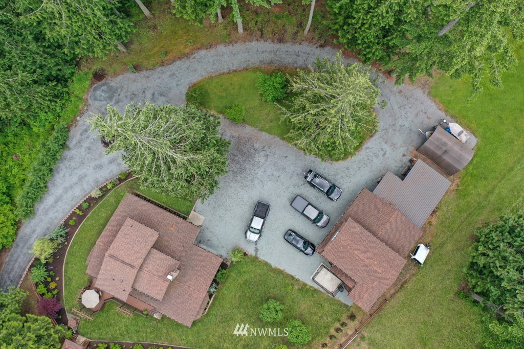 25308 Brooks Road East Orting, WA 98360 - Photo 3 of 40 an aerial view of a house with a yard and greenery